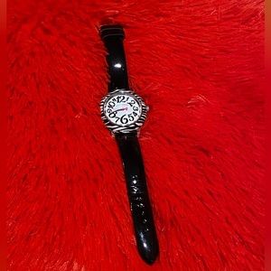 Cute Betsey Johnson watch,black and white zebra with black patent leather band.